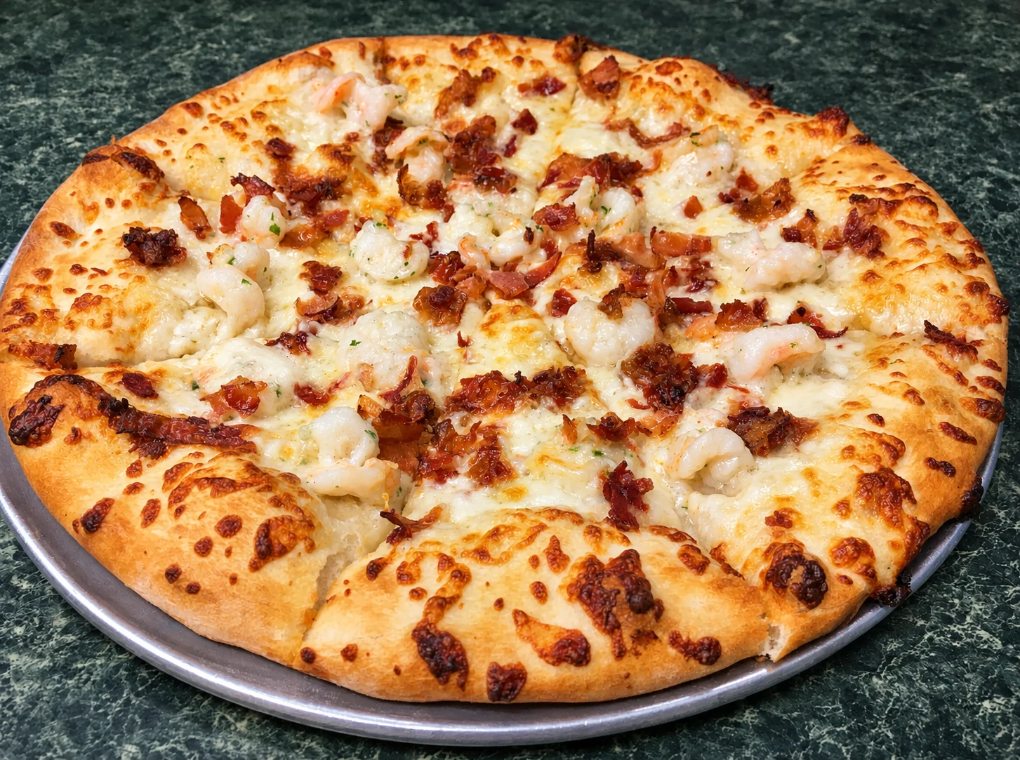 White pizza topped with shrimp and crisp bacon