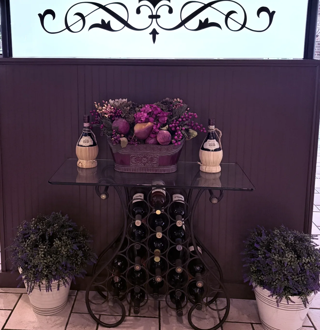 Wine display and floral arrangement inside Mama Teresa's
